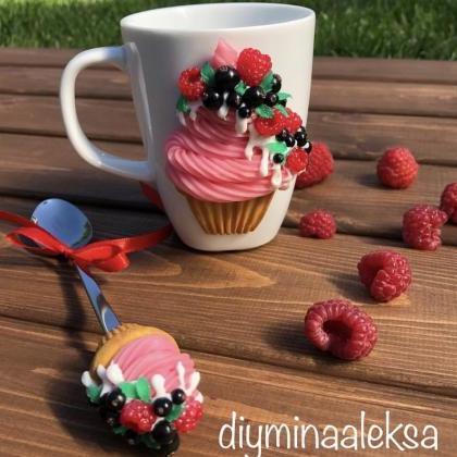 Sweet cupcake with berries on a mug..