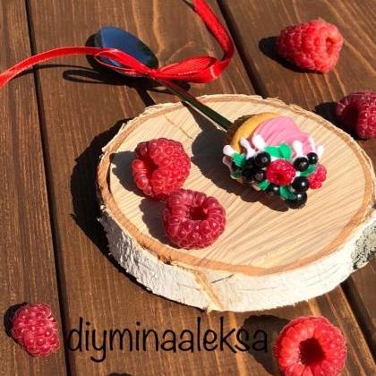 Sweet cupcake with berries on a mug..