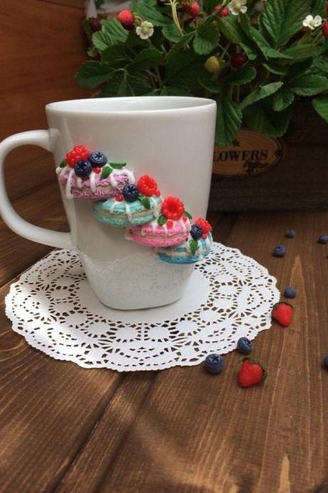 White cup for tea, Sweet mug and spoon decor, macaroons on a mug, delicious spoon with berries